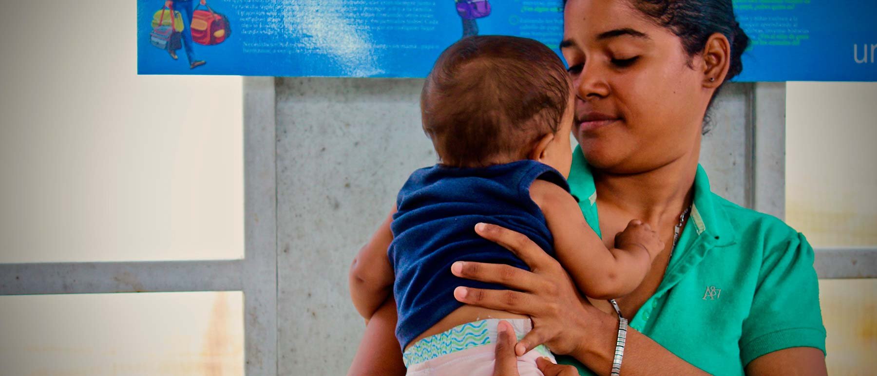 Madre venezolana en busca de atención médica Madre venezolana en busca de atención médica